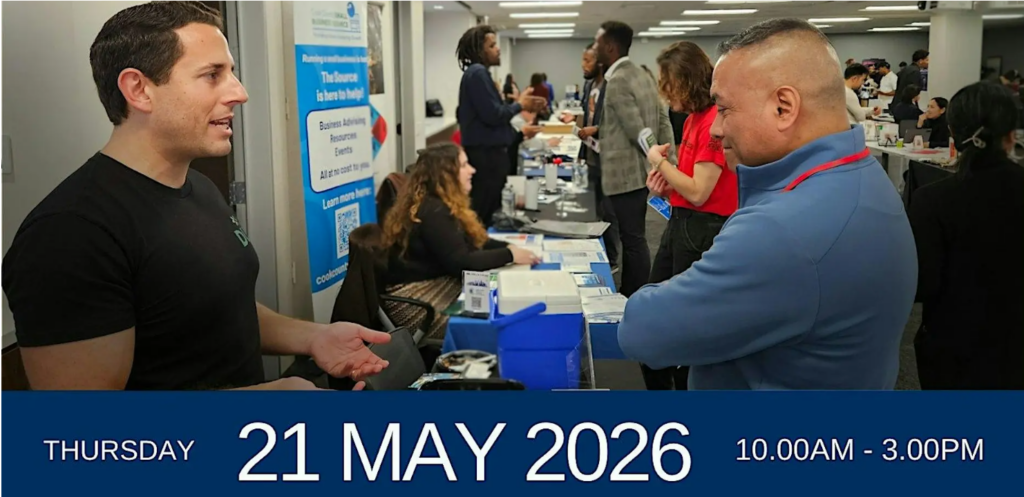 two men talking over booth