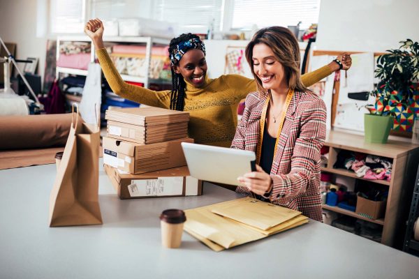 excited women entrepreneur business partners