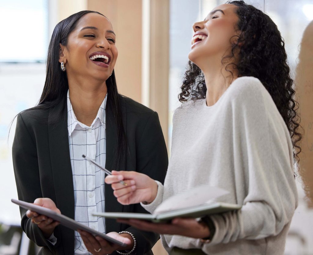 women entrepreneurs laughing together